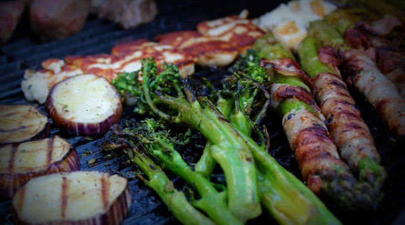 grilled meat with green vegetable on top